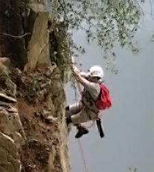 PNHP assisted PGC staff with peregrine falcon
banding at a nest site. Here, WPC herpetologist
Charlie Eichelberger climbs a rock face to
investigate one of the state’s only cliff nests.
Photo by: Cal Butchkoski, PA Game Commission