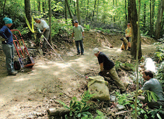 WPC staff, volunteers and paid contractors maneuvered large rocks as
part of a trail restoration project.