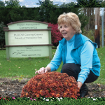Huntingdon Mayor Dee Dee Brown tends to a garden in her community. 